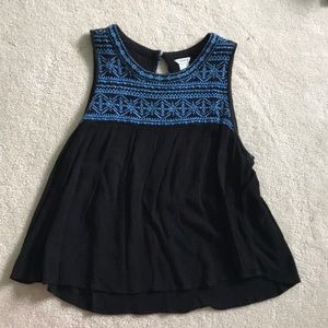 black top with blue embroidery
